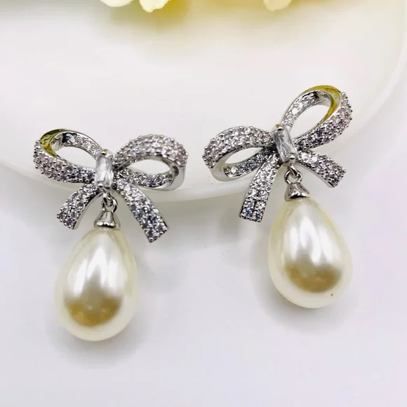 Anthro Shashi Pave Pearl Bow Earrings - Picture 5 of 6